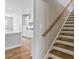 Inviting view of a white kitchen featuring stainless steel appliances and hardwood floors at 6907 Hunts Mesa Dr, Fort Mill, SC 29707