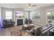 Cozy living room features a fireplace and multiple windows for natural light at 6907 Hunts Mesa Dr, Fort Mill, SC 29707