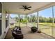 Enclosed porch with view of backyard, perfect for relaxation and outdoor entertaining, featuring a fire pit at 6907 Hunts Mesa Dr, Fort Mill, SC 29707