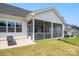 Covered porch on the home's exterior with room to stretch out and a sun-bathing chair at 6907 Hunts Mesa Dr, Fort Mill, SC 29707