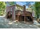 The brick home has a wooden deck and access to a concrete patio at 9334 New Towne Dr, Matthews, NC 28105
