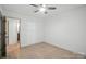 Bedroom featuring wood floors, ceiling fan, and closet space at 9334 New Towne Dr, Matthews, NC 28105