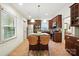 A spacious kitchen featuring stainless steel appliances, granite countertops and an island with seating at 9334 New Towne Dr, Matthews, NC 28105