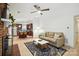 Bright, open-concept living room flowing into the kitchen, featuring hardwood floors and a cozy fireplace at 9334 New Towne Dr, Matthews, NC 28105