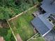 Aerial view of backyard with a fenced lawn and wooden deck with patio seating at 112 8Th Nw Ave, Hickory, NC 28601