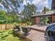 Outdoor wooden deck features seating, mature trees, and is ideal for entertaining at 112 8Th Nw Ave, Hickory, NC 28601