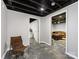 The basement has painted concrete floors, neutral walls, and a doorway that leads to another room at 112 8Th Nw Ave, Hickory, NC 28601