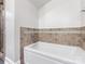 This bathroom features a soaking tub with tile surround and a glass enclosed shower at 112 8Th Nw Ave, Hickory, NC 28601