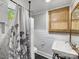 Bathroom with updated tile, pedestal sink, and stylish fixtures creating a calming space at 112 8Th Nw Ave, Hickory, NC 28601