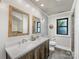 Updated bathroom with a double sink vanity and rustic mirror frames at 112 8Th Nw Ave, Hickory, NC 28601