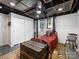 Finished basement bedroom with closet space, windows with curtains, and a bed at 112 8Th Nw Ave, Hickory, NC 28601