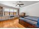 Bedroom with a built-in desk/shelving unit, hardwood floors, and natural light at 112 8Th Nw Ave, Hickory, NC 28601