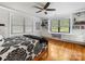 This bright bedroom has hardwood floors, large windows with blinds, and built-in shelves and drawers at 112 8Th Nw Ave, Hickory, NC 28601
