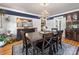 Sophisticated dining room featuring a chandelier, navy blue trim, decorative mirror, and a wooden dining set at 112 8Th Nw Ave, Hickory, NC 28601