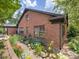 Charming brick home features landscaping with vibrant flowers creating a welcoming curb appeal at 112 8Th Nw Ave, Hickory, NC 28601