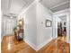 Hallway with hardwood floors, white walls, and neutral decor at 112 8Th Nw Ave, Hickory, NC 28601