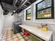 Bright laundry room features large windows, modern washer/dryer, and counter space at 112 8Th Nw Ave, Hickory, NC 28601