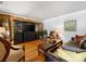 Warm and inviting living room featuring hardwood floors, wood paneling, comfortable furnishings, and an entertainment center at 112 8Th Nw Ave, Hickory, NC 28601