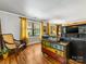 Cozy living room featuring hardwood floors, natural light, eclectic decor, and comfortable furnishings at 112 8Th Nw Ave, Hickory, NC 28601