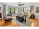 Bright main bedroom with hardwood floors, two windows, and a metal bed frame at 112 8Th Nw Ave, Hickory, NC 28601
