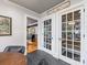 A pantry with glass paneled doors provides ample storage space off the eat-in kitchen at 112 8Th Nw Ave, Hickory, NC 28601