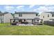 Spacious backyard featuring a nice patio area with two gazebos, perfect for outdoor living at 1216 Catawba Run, Lowell, NC 28098