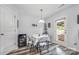 Cozy breakfast nook with a table for four and a door to the outdoor area at 1216 Catawba Run, Lowell, NC 28098