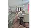 Dining room with an elegant table setting, modern chandelier, and decorative rug at 1216 Catawba Run, Lowell, NC 28098