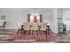 Elegant dining room with seating for six, modern flooring, and natural light at 1216 Catawba Run, Lowell, NC 28098