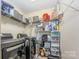 A well-organized laundry room with shelving units and a modern washer and dryer at 1216 Catawba Run, Lowell, NC 28098