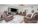 Comfortable living room with plush seating, a fireplace, and entertainment center at 1216 Catawba Run, Lowell, NC 28098