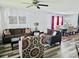 Bright and airy living room featuring hardwood floors and comfortable seating arrangements at 1216 Catawba Run, Lowell, NC 28098