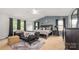 Spacious main bedroom features a tray ceiling, ample natural light, and carpeted floors at 1216 Catawba Run, Lowell, NC 28098