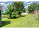 Expansive backyard with mature trees and lush green grass, partially fenced in at 127 Bristol Rd, Statesville, NC 28677