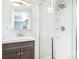 Bright bathroom featuring a glass enclosed shower and classic vanity at 127 Bristol Rd, Statesville, NC 28677