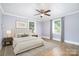 Bedroom with stylish decor, hardwood floors, a ceiling fan, and natural light at 127 Bristol Rd, Statesville, NC 28677