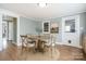 Charming dining room with a round wood table, seating for four, and natural light at 127 Bristol Rd, Statesville, NC 28677