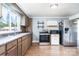 Functional kitchen with wood cabinets, stainless steel appliances, and a window view at 127 Bristol Rd, Statesville, NC 28677
