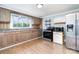 Functional kitchen with wood cabinets, stainless steel appliances, and a window view at 127 Bristol Rd, Statesville, NC 28677