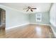 Unfurnished Living Room featuring hardwood floors, window and paneled walls at 127 Bristol Rd, Statesville, NC 28677