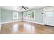 Bright, airy living room with hardwood floors, large windows, and a paneled wall at 127 Bristol Rd, Statesville, NC 28677