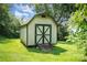 Exterior view of a quaint shed in the backyard on a sunny day at 127 Bristol Rd, Statesville, NC 28677