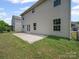 View of the backyard with patio and vinyl siding at 1307 Farm Branch Sw Dr, Concord, NC 28027
