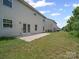 View of the backyard and vinyl siding at 1307 Farm Branch Sw Dr, Concord, NC 28027