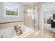 Bathroom featuring tub, shower, and natural light at 1307 Farm Branch Sw Dr, Concord, NC 28027