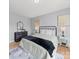 Bedroom with natural light, a modern bed, and stylish decor at 1307 Farm Branch Sw Dr, Concord, NC 28027