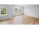 Bedroom featuring hardwood floors, light-filled windows at 1307 Farm Branch Sw Dr, Concord, NC 28027