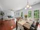 Bright dining area with hardwood floors and a view to the open living room at 1307 Farm Branch Sw Dr, Concord, NC 28027
