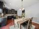 Cozy dining area featuring pendant lighting and views of the open kitchen at 1307 Farm Branch Sw Dr, Concord, NC 28027
