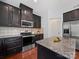 Well-equipped kitchen with stainless steel appliances and granite countertops at 1307 Farm Branch Sw Dr, Concord, NC 28027